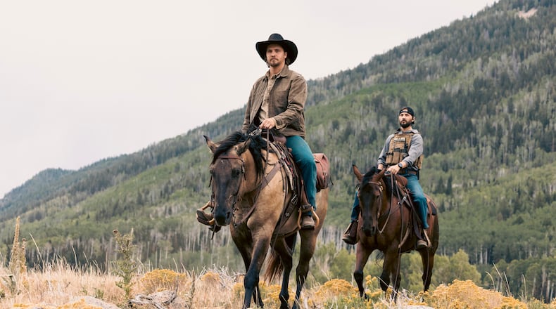 This image released by CBS Entertainment shows Luke Grimes as Kayce Dutton, center, and Logan Marshall-Green as Pete Calvin in a scene from "Marshals." (Sonja Flemming/CBS via AP)