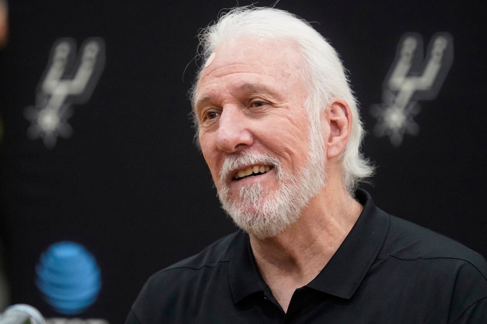 FILE - San Antonio Spurs head coach Gregg Popovich smiles during the NBA basketball team's media day, Monday, Sept. 27, 2021, in San Antonio. (AP Photo/Eric Gay, File)