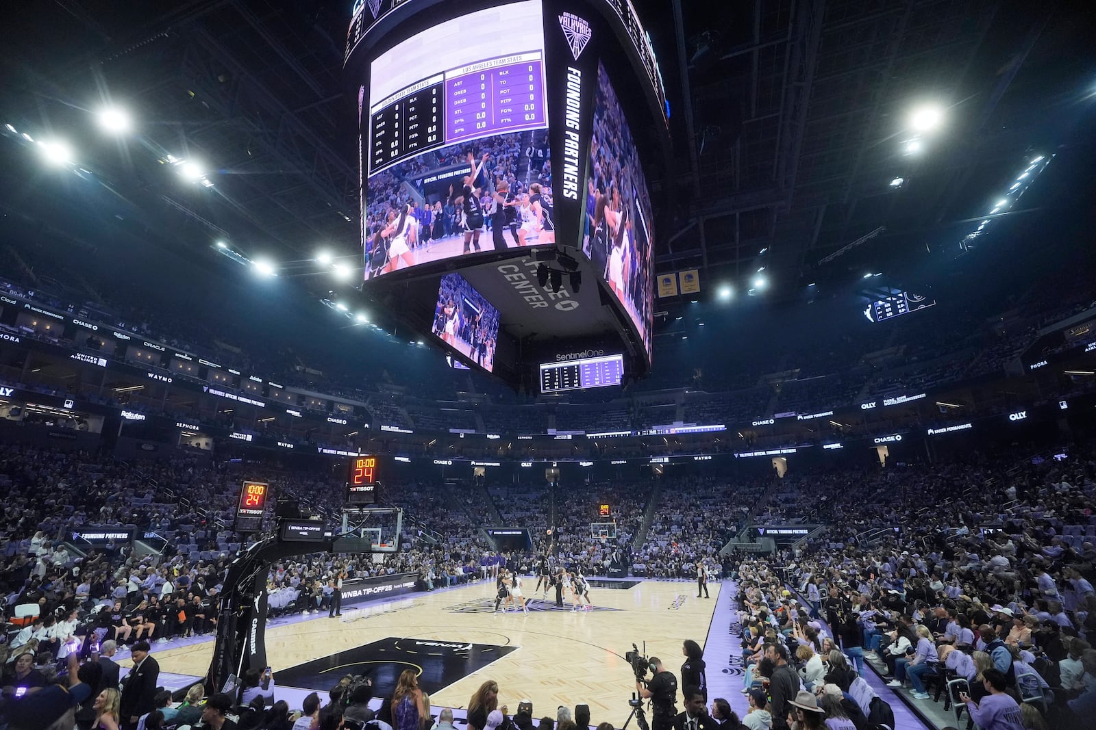 Players jump for the opening tip-off during the first half of a WNBA basketball game between the Golden State Valkyries and the Los Angeles Sparks in San Francisco, Friday, May 16, 2025. (AP Photo/Jeff Chiu)