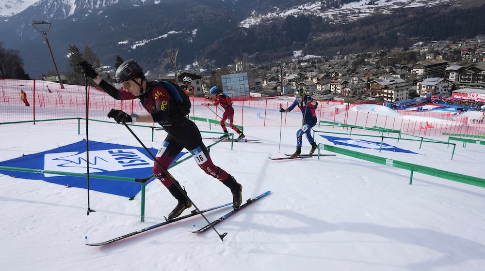 FILE - Athletes compete during the men's sprint race at the Ski Mountaineering World Cup event in Bormio, Italy, Saturday, Feb. 22, 2025. (AP Photo/Antonio Calanni, File)