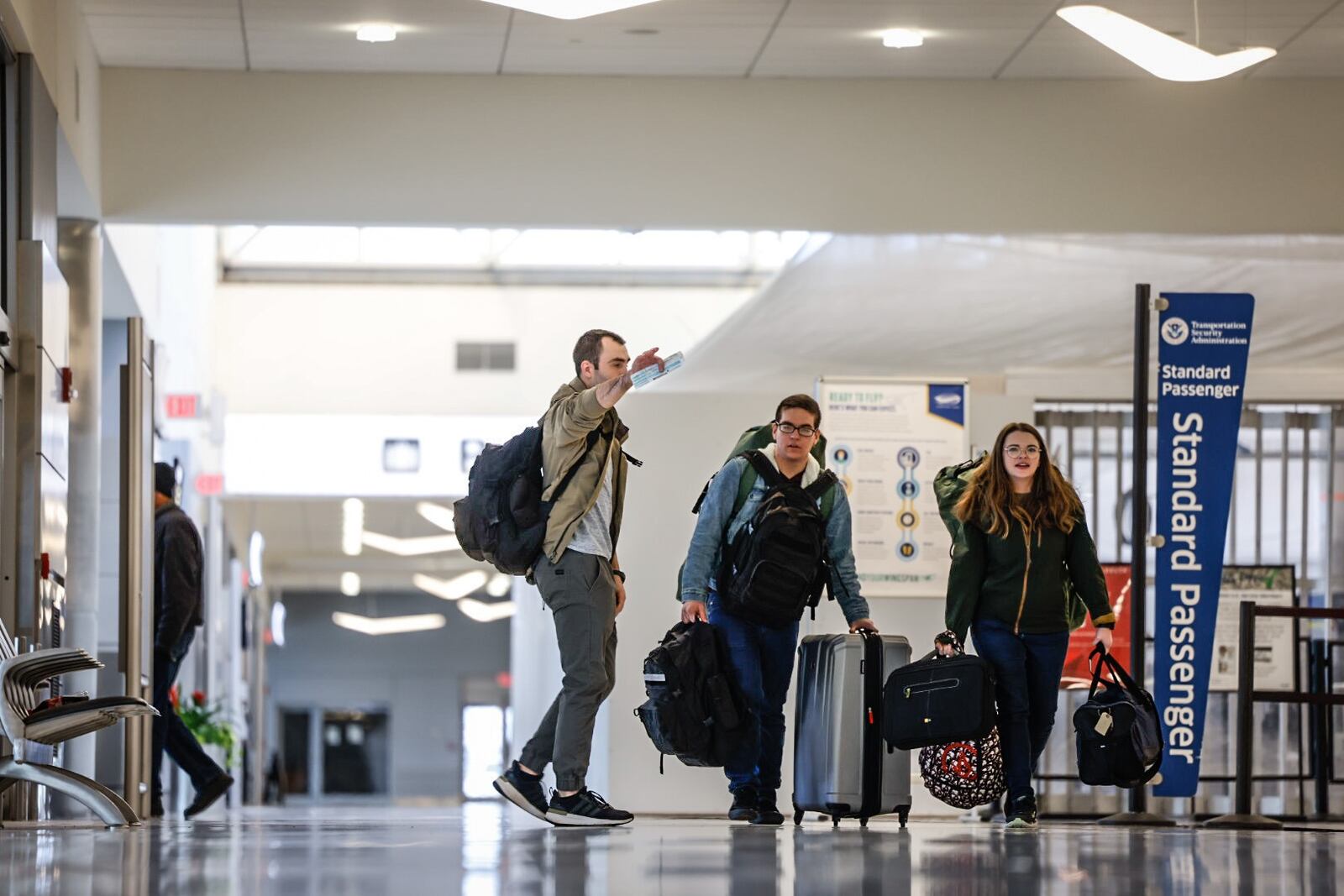 Traveler at the Dayton International Airport walk to the TSA checkpoint Friday November 18, 2022. Jim Noelker/Staff