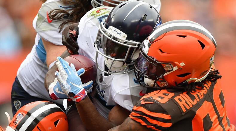 CLEVELAND, OH - SEPTEMBER 08: Dion Lewis #33 of the Tennessee Titans is met at the line of scrimmage by Sheldon Richardson #98 of the Cleveland Browns in the first quarter at FirstEnergy Stadium on September 08, 2019 in Cleveland, Ohio . (Photo by Jamie Sabau/Getty Images)