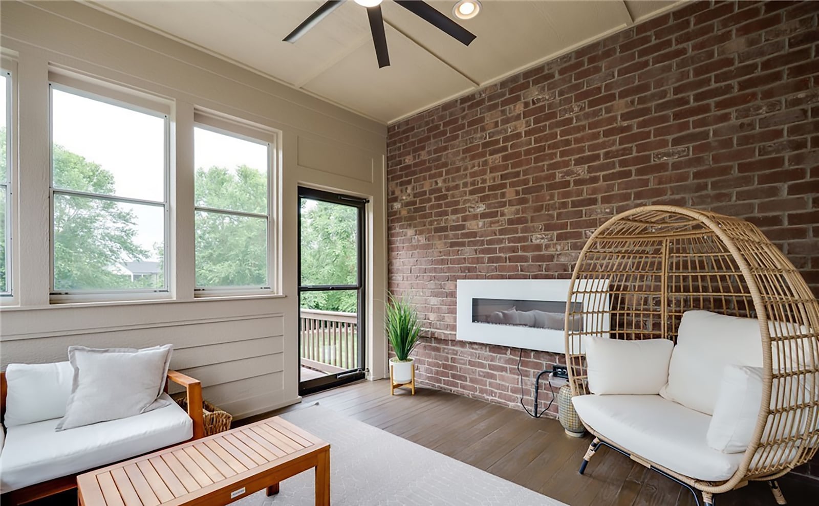 Off the living room is the sun room. It has wood floors, an electric fireplace, ceiling fan and recessed lighting. An exterior door opens to the back deck. CONTRIBUTED