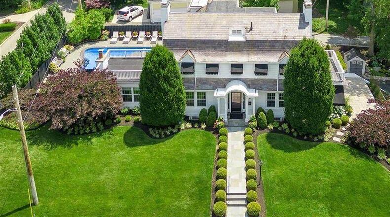 The almost half-acre Oakwood property was featured in the 2023 Garden Tour with its terraced side yard and expanded outdoor living space, complete with an inground swimming pool. Contributed