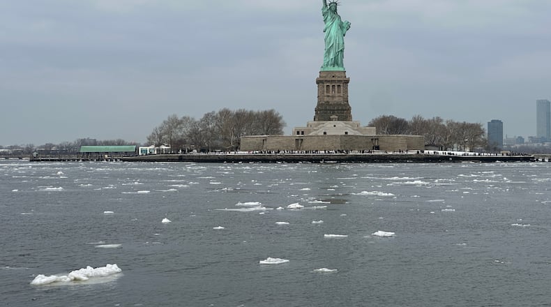 Ice is in front of the Statue of Liberty as seen from the Coast Guard Cutter Hawser icebreaker tug boat in Upper New York Harbor in New York, Wednesday, Feb. 11, 2026. (AP Photo/Ted Shaffrey)
