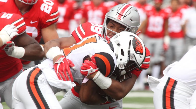 Ohio State’s Malik Harrison tackles Oregon State’s Artais Pierce on Saturday, Sept. 1, 2018, at Ohio Stadium in Columbus. David Jablonski/Staff
