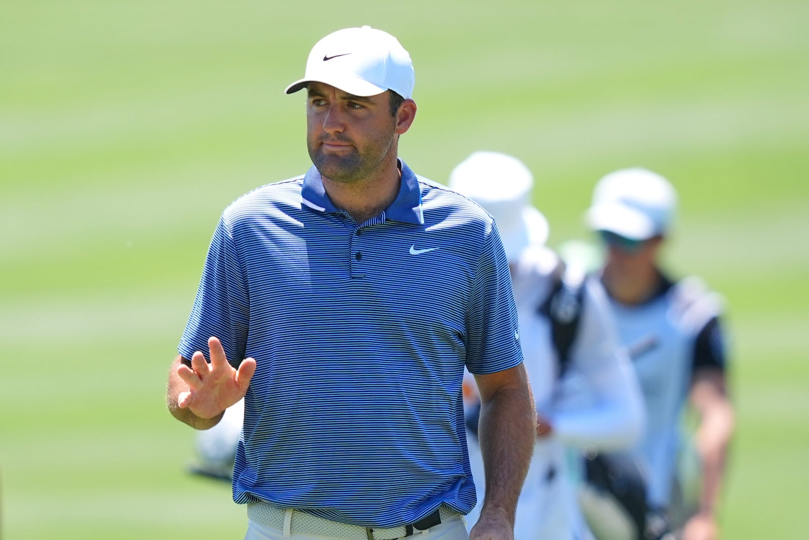 Scottie Scheffler waves after sinking a putt on the sixth green during the final round of the CJ Cup Byron Nelson golf tournament in McKinney, Texas, Sunday, May 4, 2025. (AP Photo/LM Otero)