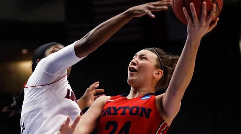 Dayton guard Andrea Hoover (24) shoots against Louisville forward Myisha Hines-Allen (2) during the first half of a women's college basketball regional semifinal game in the NCAA Tournament on Saturday, March 28, 2015, in Albany, N.Y. (AP Photo/Mike Groll)