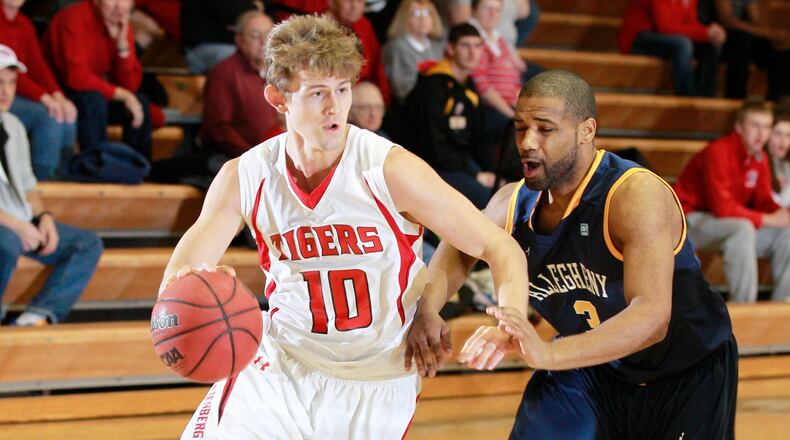 Zack Leahy (10) of Wittenberg is guarded by D'Andre Corbin (3) of Allegheny during Saturday's basketball game at the Pam Evans Smith Arena on Dec. 8, 2012. Photo by Barbara J. Perenic/Cox Media Group