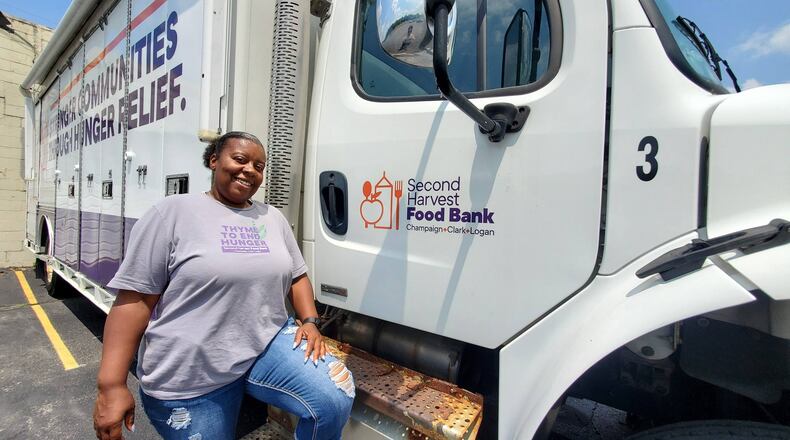 Second Harvest Food Bank Distribution & Pantry Specialist, Shana Riggins, poses with a Second Harvest Food Bank mobile pantry truck. Contributed Photo by Allie Godfrey