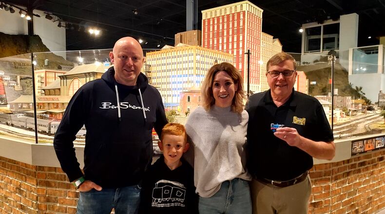 EnterTRAINment Junction owner Don Oeters, right, poses with Victoria and Andrew Royds and their son, Enzo. The Royds family came to West Chester Twp. from New Zealand to see the venue. CONTRIBUTED