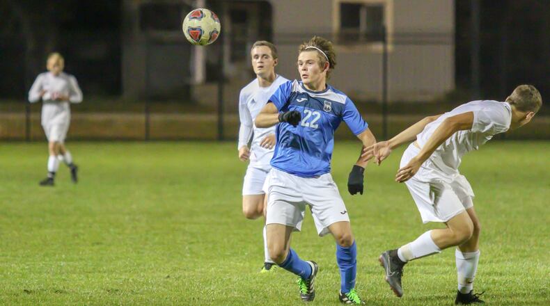Northwestern High School’s Jeremy Howard tussles with Bellefontaine’s Brock Wrocklage during their Division II sectional final match at Piqua High School’s Wertz Stadium on Monday, Oct. 22. The Chieftains won 2-1. CONTRIBUTED PHOTO BY MICHAEL COOPER