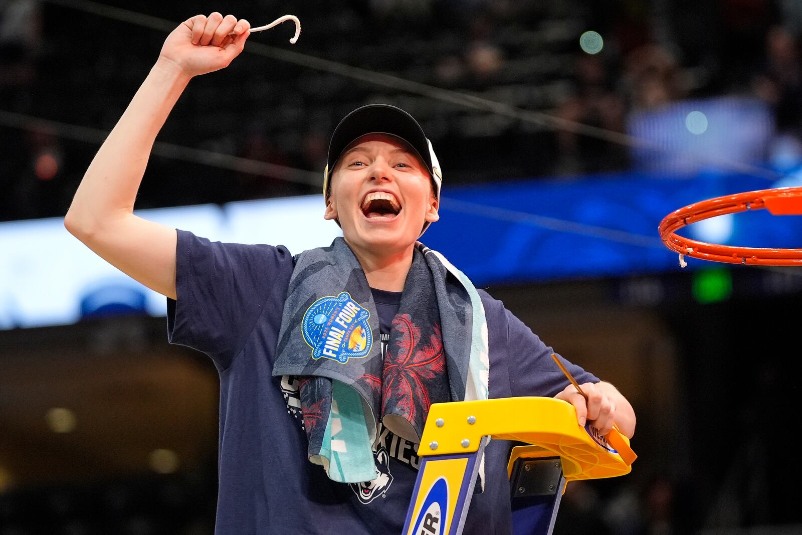 UConn guard Paige Bueckers holds up a piece of the net after the Huskies defeated South Carolina inthe national championship game at the Final Four of the women's NCAA college basketball tournament, Sunday, April 6, 2025, in Tampa, Fla. (AP Photo/John Raoux)