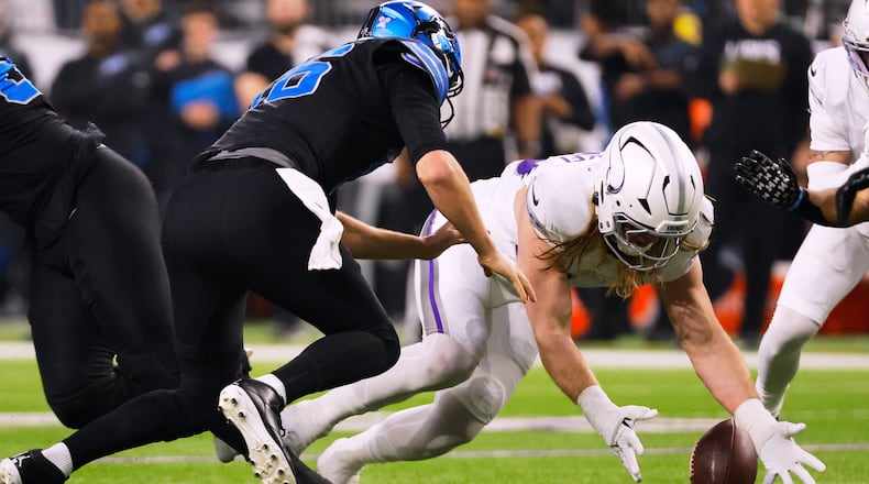 Minnesota Vikings linebacker Andrew van Ginkel, right, recovers a fumble by Detroit Lions quarterback Jared Goff, left, during the first half of an NFL football game, Thursday, Dec. 25, 2025, in Minneapolis. (AP Photo/Bruce Kluckhohn)