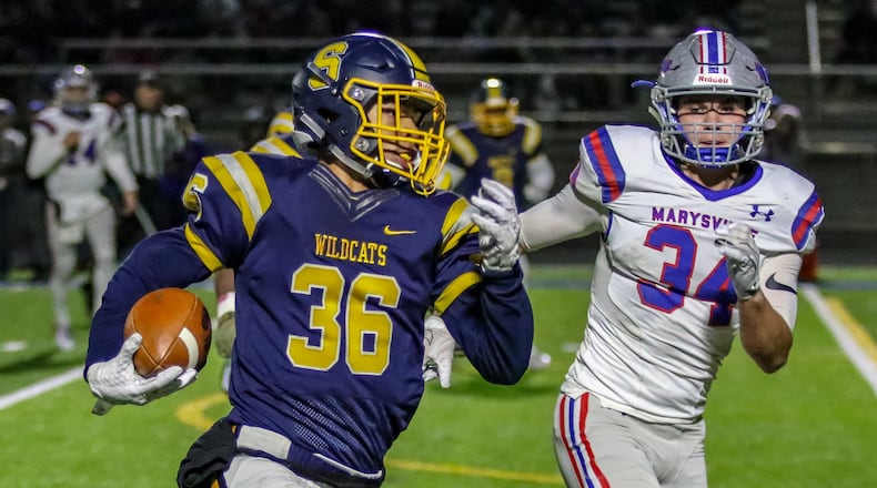 Springfield High School’s Delian Bradley returns a fumble during their Division I, Region 2 quarterfinal game against Marysville on Friday night at Springfield High School. The Wildcats on 23-0. CONTRIBUTED PHOTO BY MICHAEL COOPER