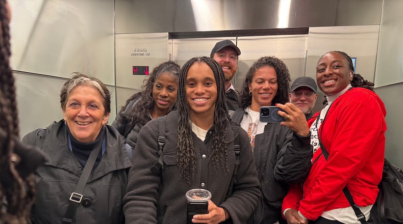 WNBA players and union members pose for a photo in an elevator after a negotiating session at the NBA headquarters on March 13, 2026, in New York. (Alysha Clark via AP)