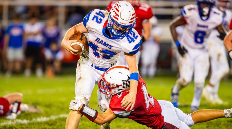Greeneview High School junior Cooper Payton is tackled by Southeastern junior Cole Dent during their game earlier this season in South Charleston. Michael Cooper/CONTRIBUTED