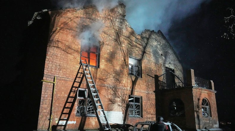 A residential building burns after a Russian strike in Kyiv, Ukraine, Friday, Jan. 9, 2026. (AP Photo/Efrem Lukatsky)
