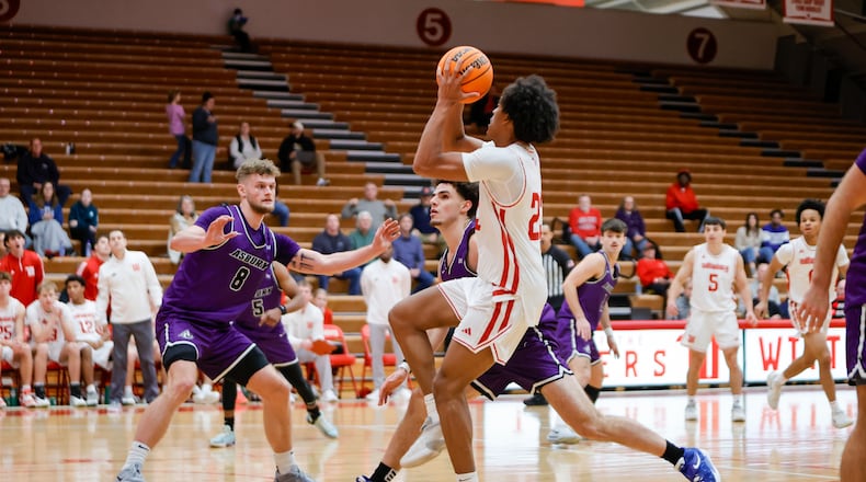 Wittenberg University senior Eddie Brown drives to the hoop during their game against Asbury on Tuesday, Dec. 30 at Pam Evans Smith Arena. MICHAEL COOPER / STAFF PHOTO