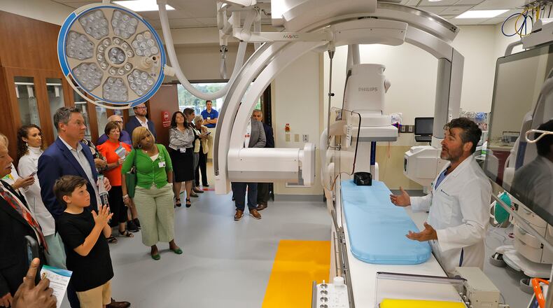 Neurologist Dr. Jody Short explains Mercy Health's new Interventional Neurology Suite at Springfield Regional Medical Center on Wednesday, Sept. 6, 2023, during an open house and ribbon-cutting for the new facility. The suite features a biplane angiography, an advanced, minimally invasive technology used to diagnose and treat strokes as well as other neurological conditions. BILL LACKEY/STAFF