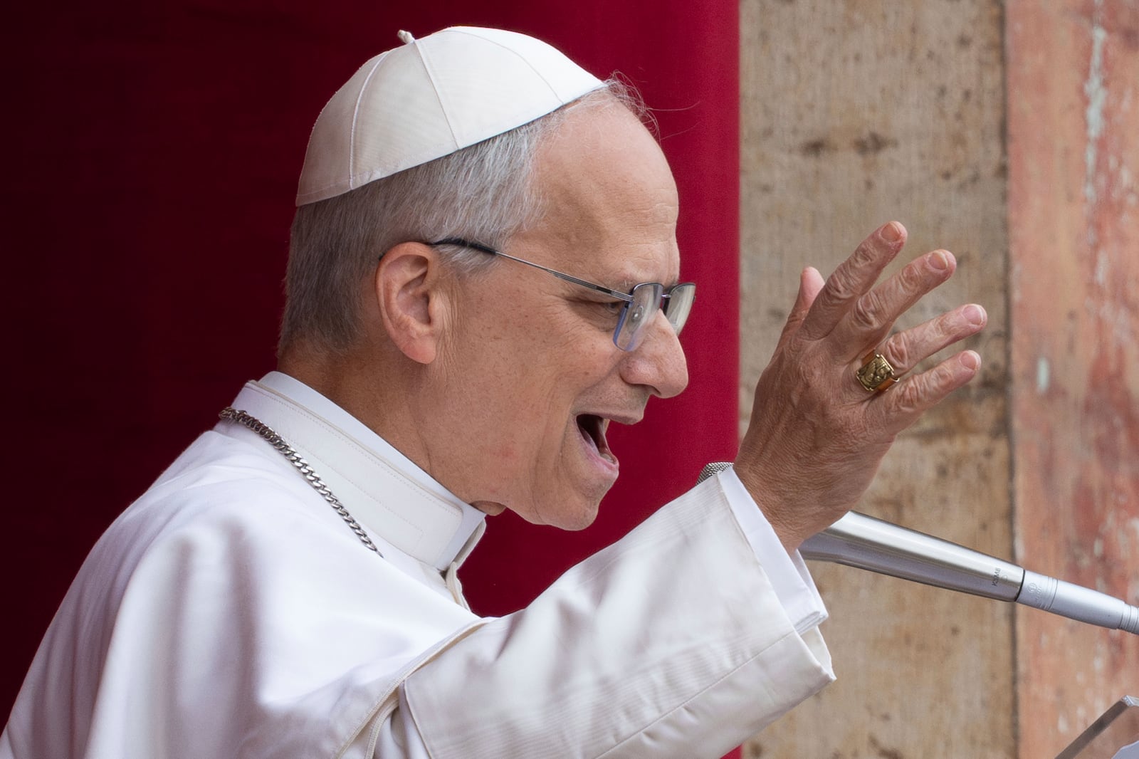 FILE- Pope Leo XIV speaks from the central balcony of St. Peter's Basilica on Sunday, May 11, 2025. (AP Photo/Domenico Stinellis, File)