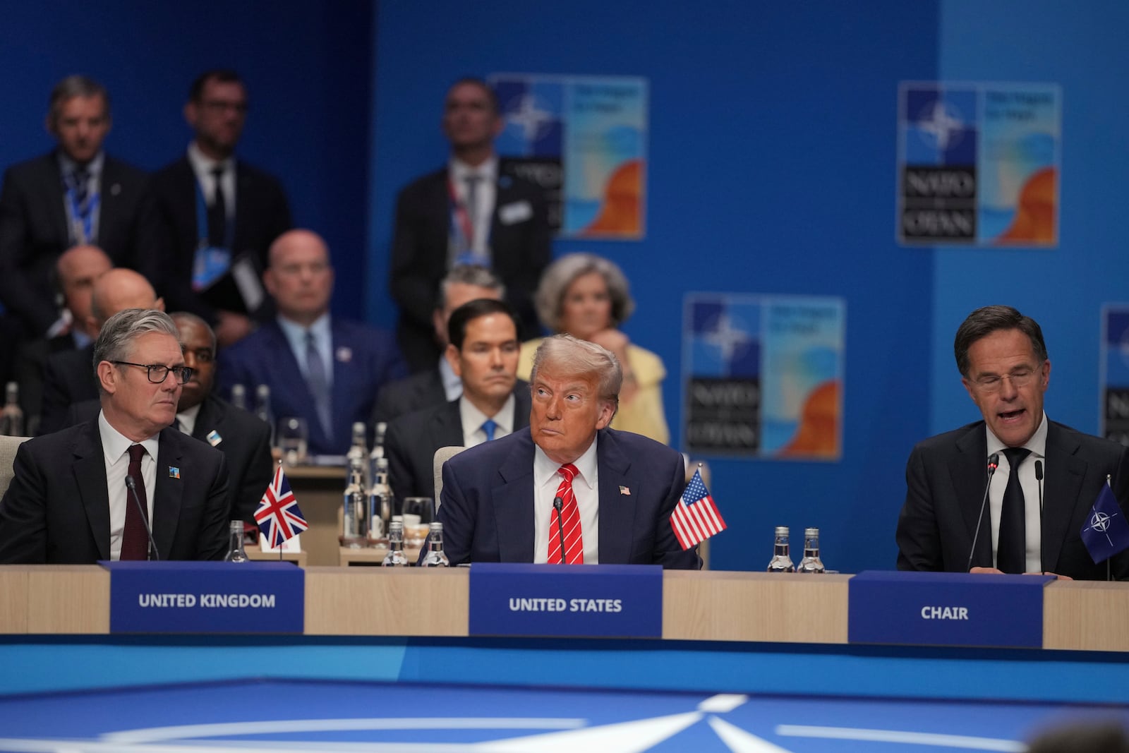 United States President Donald Trump, centre, with Britain's Prime Minister Keir Starmer, left listen to Nato General Secretary Mark Rutte during a North Atlantic Council plenary meeting during the the NATO summit in The Hague, Netherlands, Wednesday, June 25, 2025. (AP Photo Kin Cheung, Pool)