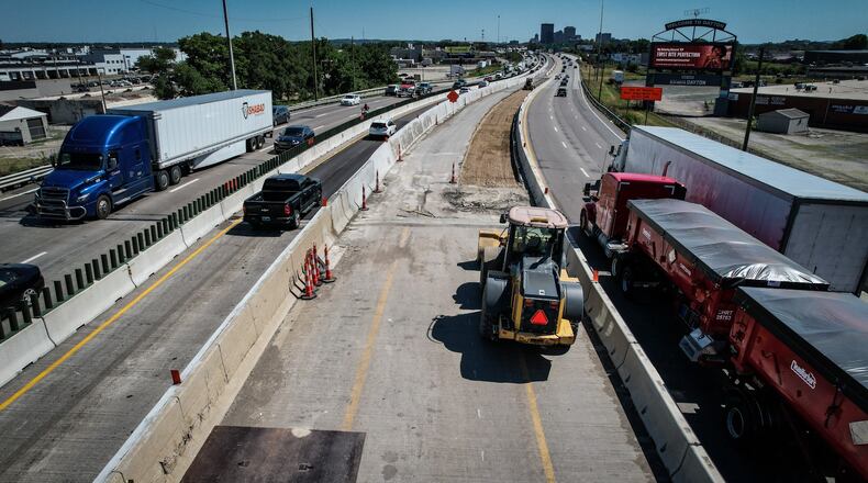 The expected completion date of the Interstate 75 reconstruction north of downtown Dayton has been pushed back a year, to summer 2027, according to ODOT. This June 13, 2024 photo shows southbound traffic split into a main section on the right, and a "contraflow" lane on the left. JIM NOELKER/STAFF