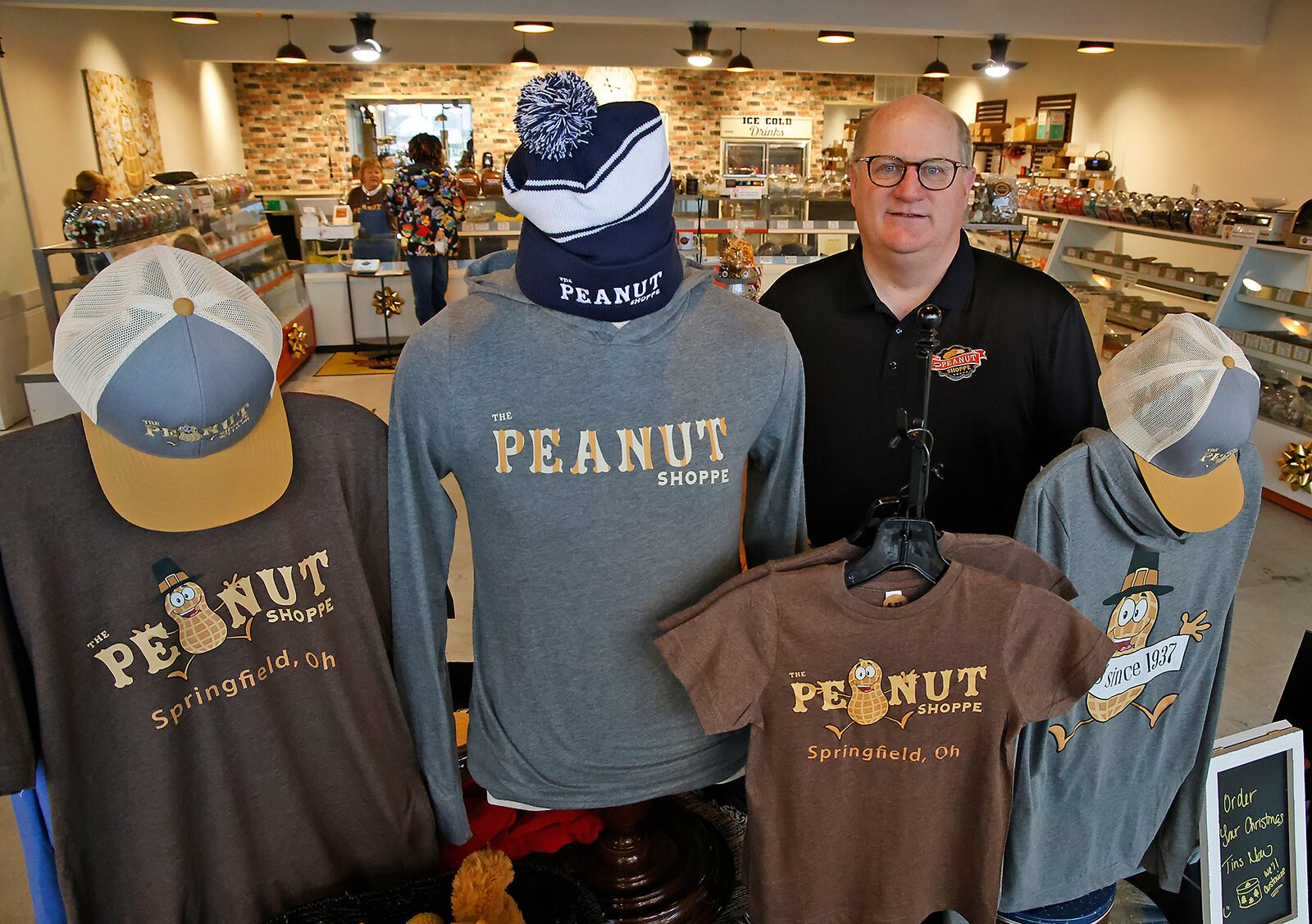 Matt Luther, owner of The Peanut Shoppe in Springfield, in the new expanded store Tuesday, Nov. 21, 2023. BILL LACKEY/STAFF