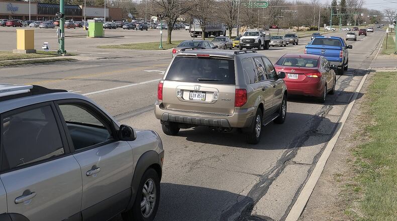 A controversial $1.8 million project to reduce Derr Road from four lanes to three lanes and add designated bike lanes on the roadway was approved to move forward on Aug. 29, despite opposition from community members. However, the Springfield City Commission could stop the project after more information is released during the design phase, commissioners said. Bill Lackey/Staff