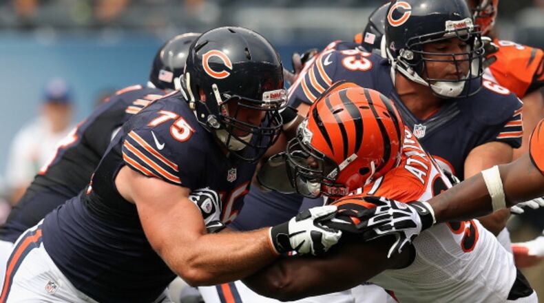 CHICAGO, IL - SEPTEMBER 08: Kyle Long #75 of the Chicago Bears blocks Geno Atkins #97 of the Cincinnati Bengals at Soldier Field on September 8, 2013 in Chicago, Illinois. The Bears defeated the Bengals 24-21. (Photo by Jonathan Daniel/Getty Images)