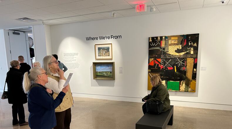 Jackie Potts and Gayle Kencheff take in artwork in one of the new gallery spaces during the Springfield Museum of Art's celebration of its north wing's reopening on Saturday.