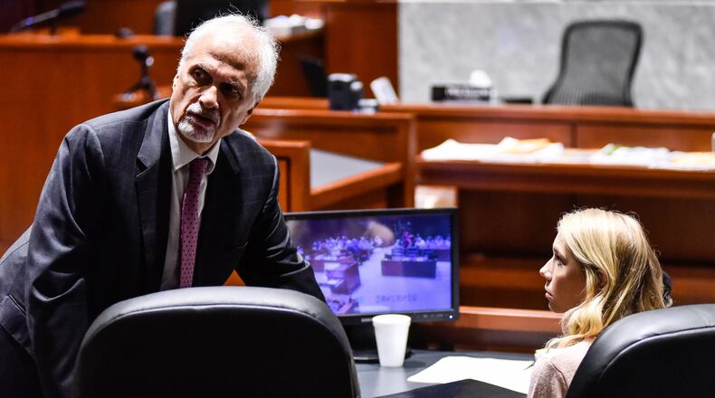 Brooke “Skylar” Richardson, right, talks to attorney Charles H. Rittgers in the courtroom before closing arguments in her trial at Warren County Common Pleas Court Thursday, September 12, 2019. The 20-year-old is accused of killing and burying her baby in the backyard of her Carlisle home. Richardson was charged with aggravated murder, involuntary manslaughter, gross abuse of a corpse, tampering with evidence and child endangerment in the death of her newborn infant. The judge dismissed the tampering with evidence charge Monday after arguments from both sides. She faces the possibility of life in prison. NICK GRAHAM/JOURNAL-NEWS/POOL