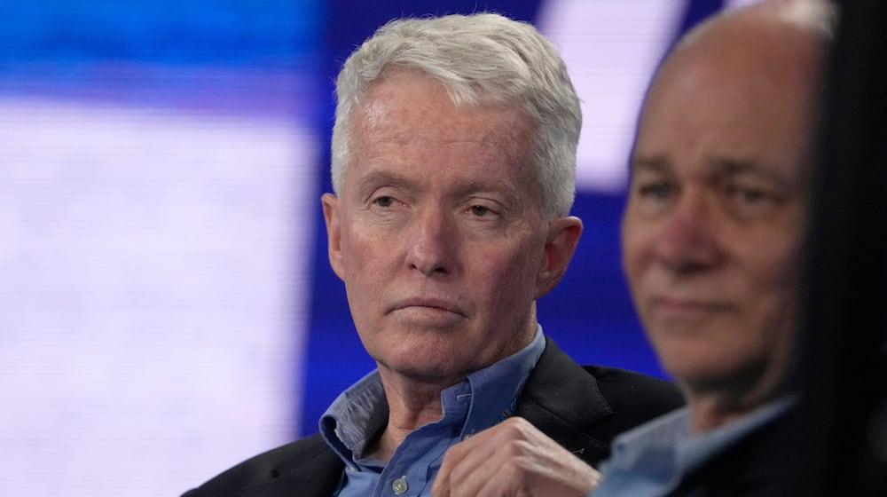 FILE - Australian Open tournament director Craig Tiley watches the fourth round match between Stefanos Tsitsipas of Greece and Jannik Sinner of Italy at the Australian Open tennis championship in Melbourne, Australia, Jan. 22, 2023. (AP Photo/Mark Baker, file)