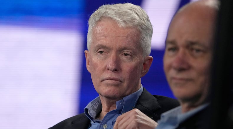 FILE - Australian Open tournament director Craig Tiley watches the fourth round match between Stefanos Tsitsipas of Greece and Jannik Sinner of Italy at the Australian Open tennis championship in Melbourne, Australia, Jan. 22, 2023. (AP Photo/Mark Baker, file)