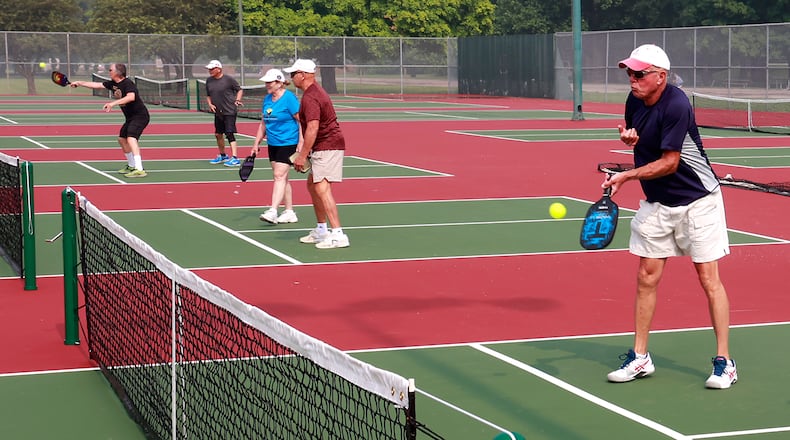 Pickleball players were taking advantage of the new courts at Snyder Park Wednesday, June 28, 2023. National Trail Parks and Recreation opened the eight new pickleball courts and three tennis courts Monday evening. BILL LACKEY/STAFF