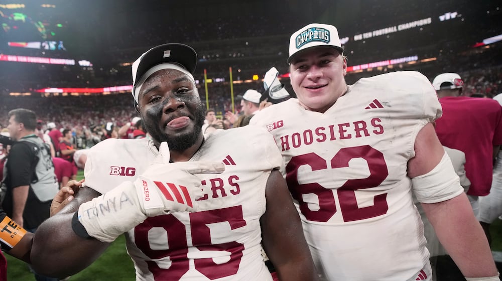 Indiana's Tyrique Tucker and Drew Evans celebrate after the Big Ten championship NCAA college football game against Ohio State in Indianapolis, Saturday, Dec. 6, 2025. (AP Photo/AJ Mast)