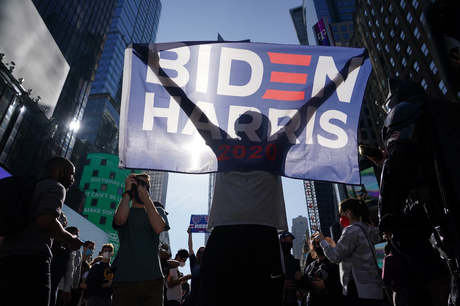 People celebrate after it was announced that Joe Biden was elected the 46th president of the United States, on Saturday, Nov. 7, 2020, at Times Square in New York. President-elect Biden achieved victory offering a message of healing and unity. He will return to Washington facing a daunting set of crises. (Chang W. Lee/The New York Times)