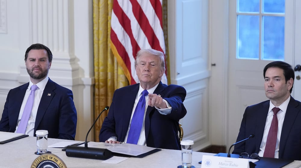 President Donald Trump chooses a reporter to ask a question with Vice President JD Vance, left, and Sec. of State Marco Rubio, right, during a meeting with oil executives in the East Room of the White House, Friday, Jan. 9, 2026, in Washington. (AP Photo/Alex Brandon)