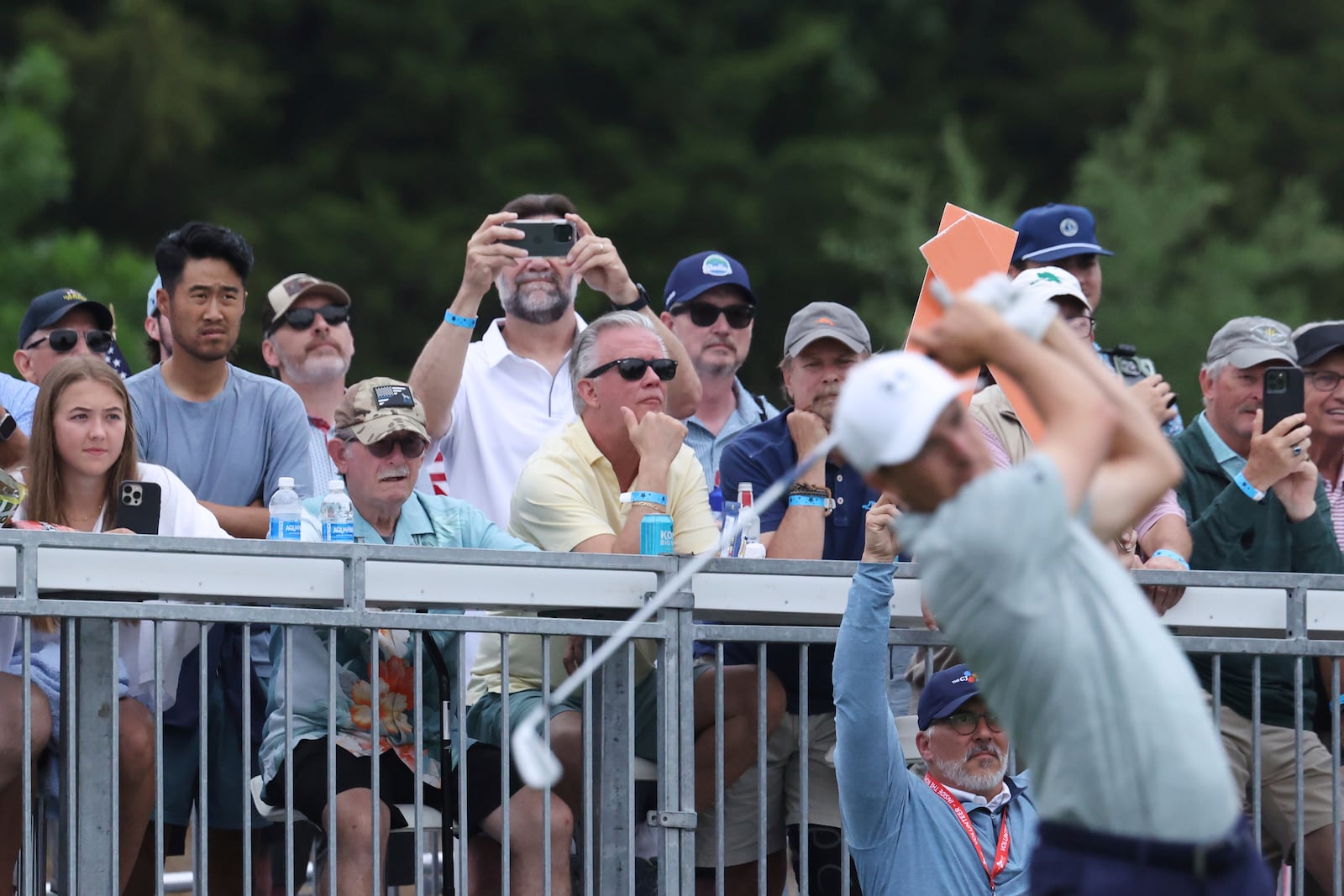 Fans watch from the gallery as Jordan Spieth, front, hits off the seventh tee during the first round of the CJ Cup Byron Nelson golf tournament in McKinney, Texas, Thursday, May 1, 2025. (AP Photo/Gareth Patterson)