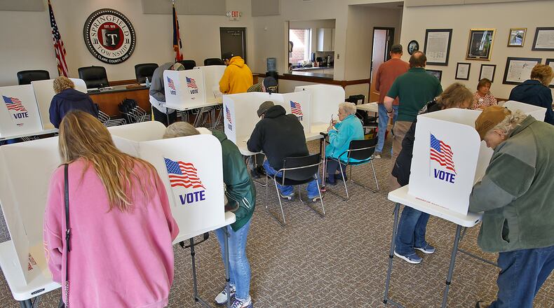 Voters fill out their ballots Tuesday, Nov. 7, 2023 at the election poll in the Springfield Township government center. BILL LACKEY/STAFF