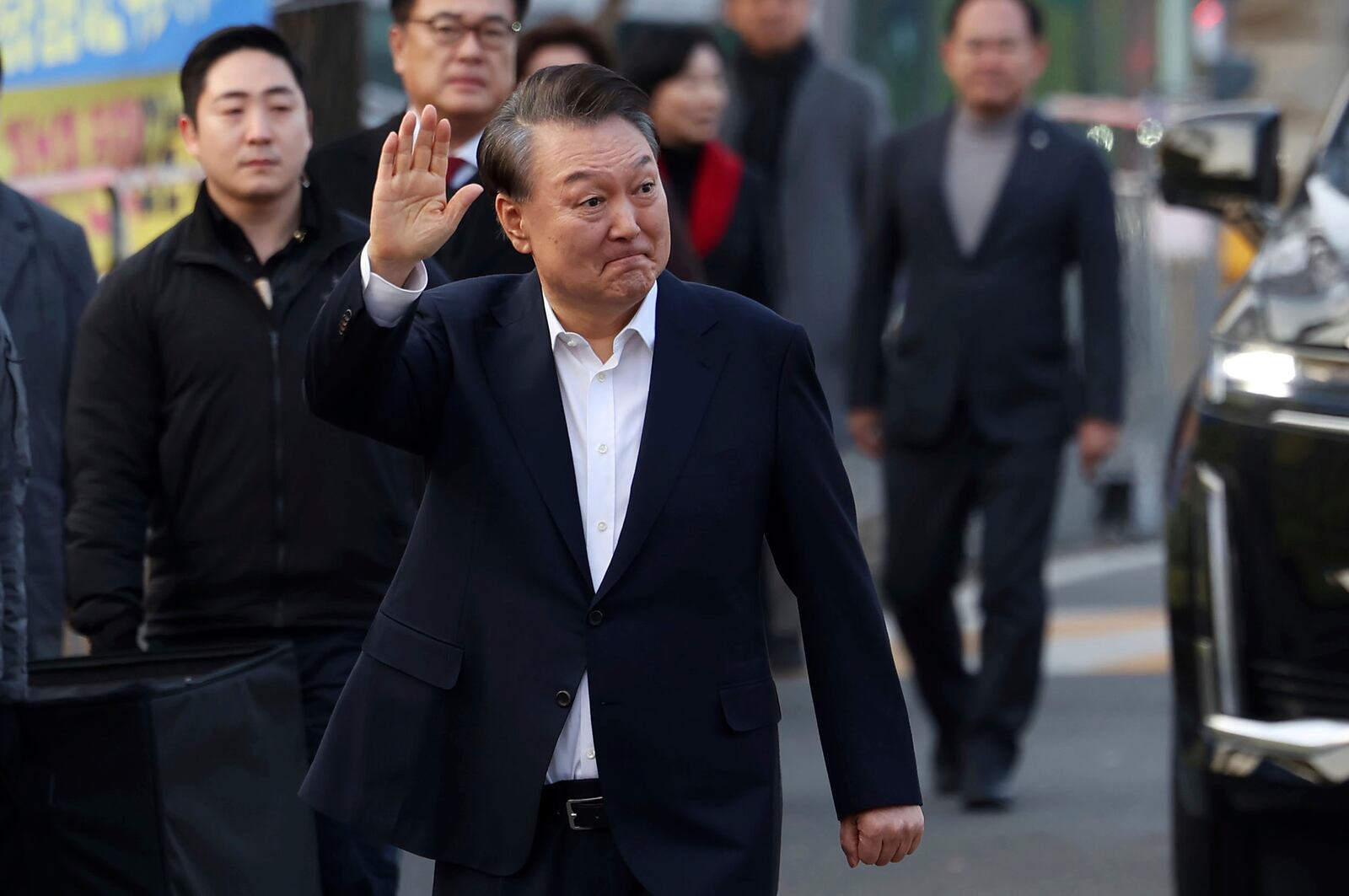 FILE - Impeached South Korean President Yoon Suk Yeol waves to his supporters as he comes out of a detention center in Uiwang, South Korea, on March 8, 2025. (Hong Hyo-shik/Newsis via AP, File)