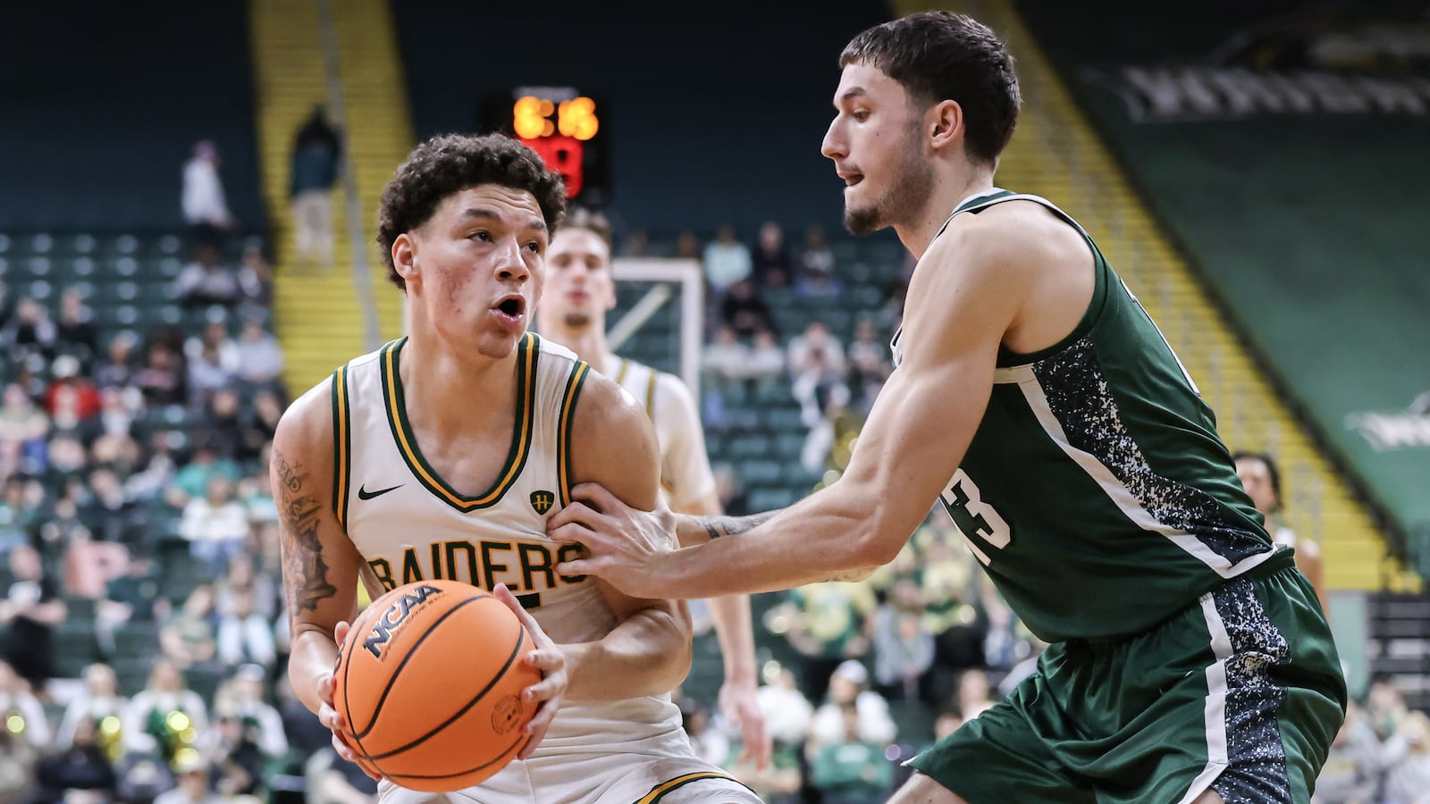 Wright State freshman guard Michael Cooper looks to shoot with pressure from Cleveland State's Lucas Burton during a Horizon League Championship first-round game on Wednesday, March 4 at Ervin J. Nutter Center in Fairborn. Cooper scored 17 points and had seven rebounds. BRYANT BILLING / STAFF