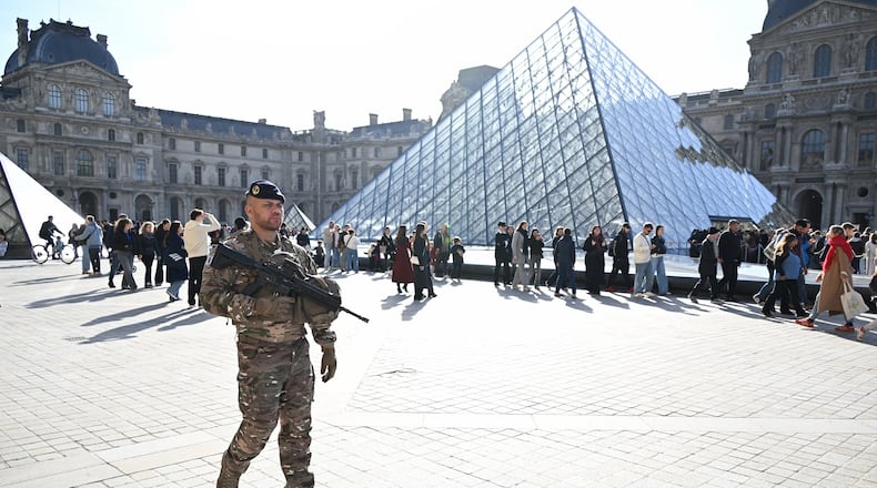A soldier patrols in courtyard of the Louvre museum, Thursday, Oct. 30, 2025 in Paris. (AP Photo/Emma Da Silva)