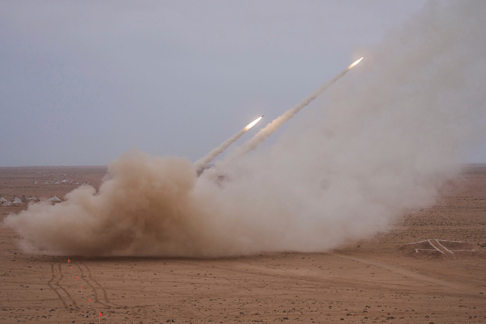 Launch trucks fires the High Mobility Artillery Rocket System (HIMARS) at its intended target during the 21st edition of the African Lion military exercise, in Tantan, south of Agadir, Morocco, Friday, May 23, 2025. (AP Photo/Mosa'ab Elshamy)