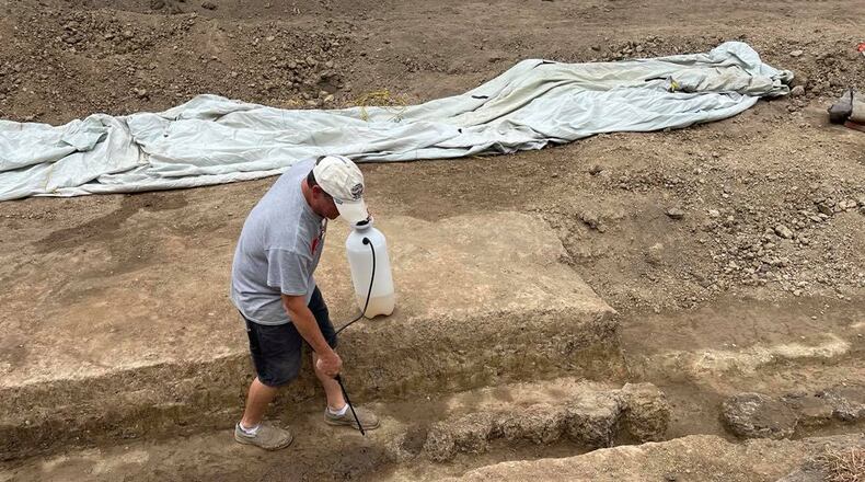 Greg Shipley highlights the remnants of the north log stockade wall of Fort Loramie. Pam Cottrel/Contributor