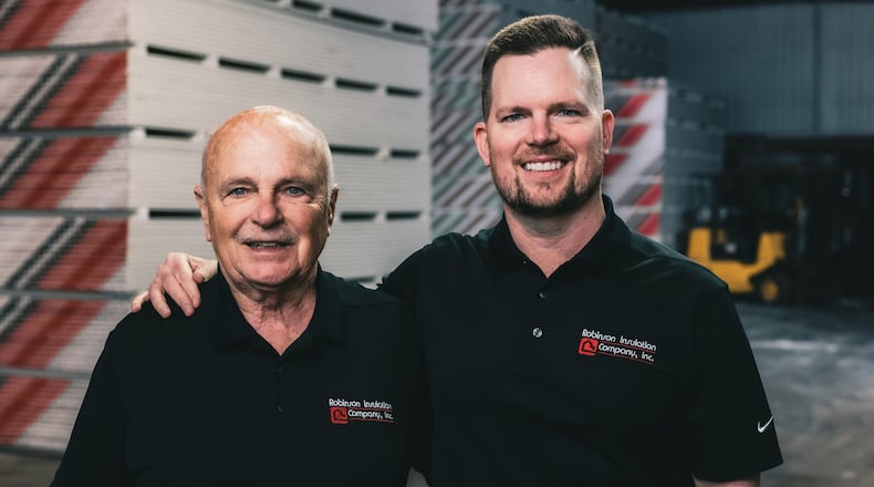 Founder Garth Robinson (left) passed his company Robinson Insulation on to son Brent Robinson (right). Garth still works full time after 50 years. CONTRIBUTED