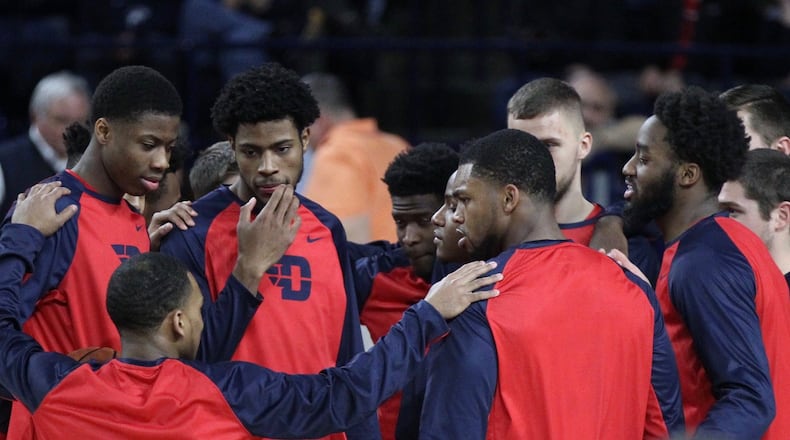 Dayton players huddle before a game against Richmond on Tuesday, Jan. 9, 2018, at the Robins Center in Richmond, Va. David Jablonski/Staff