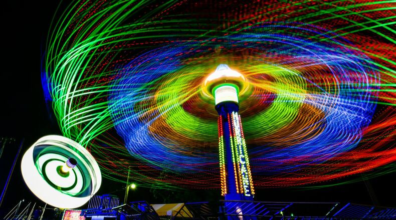 The Hurricane ride spins during the Butler County Fair in Hamilton. NICK GRAHAM/STAFF