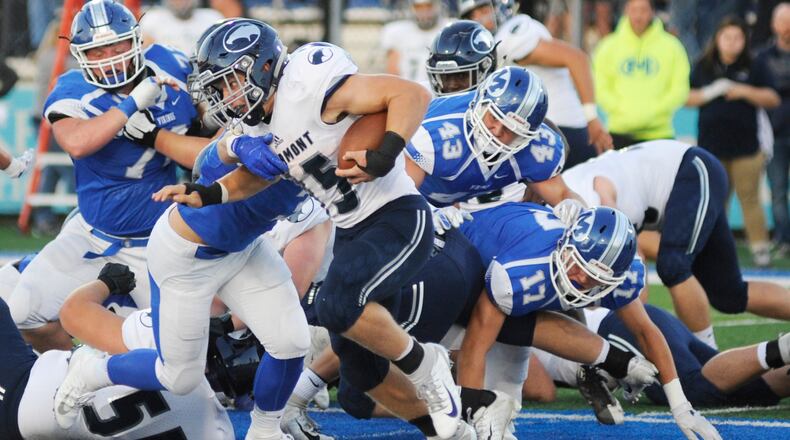 Fairmont’s Jesse Deglow is pursued by Miamisburg’s Cael Parkhurst (43), Dylan Wudke (17) and others. Fairmont defeated host Miamisburg 25-24 in a Week 6 game last season. Deglow is signing with Indiana Wesleyan, Parkhurst with Ashland and Wudke with Youngstown State. MARC PENDLETON / STAFF