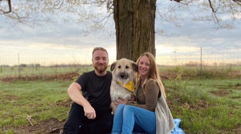 David Butcher, his partner Rachel Hammond and their dog Luna. CONTRIBUTED